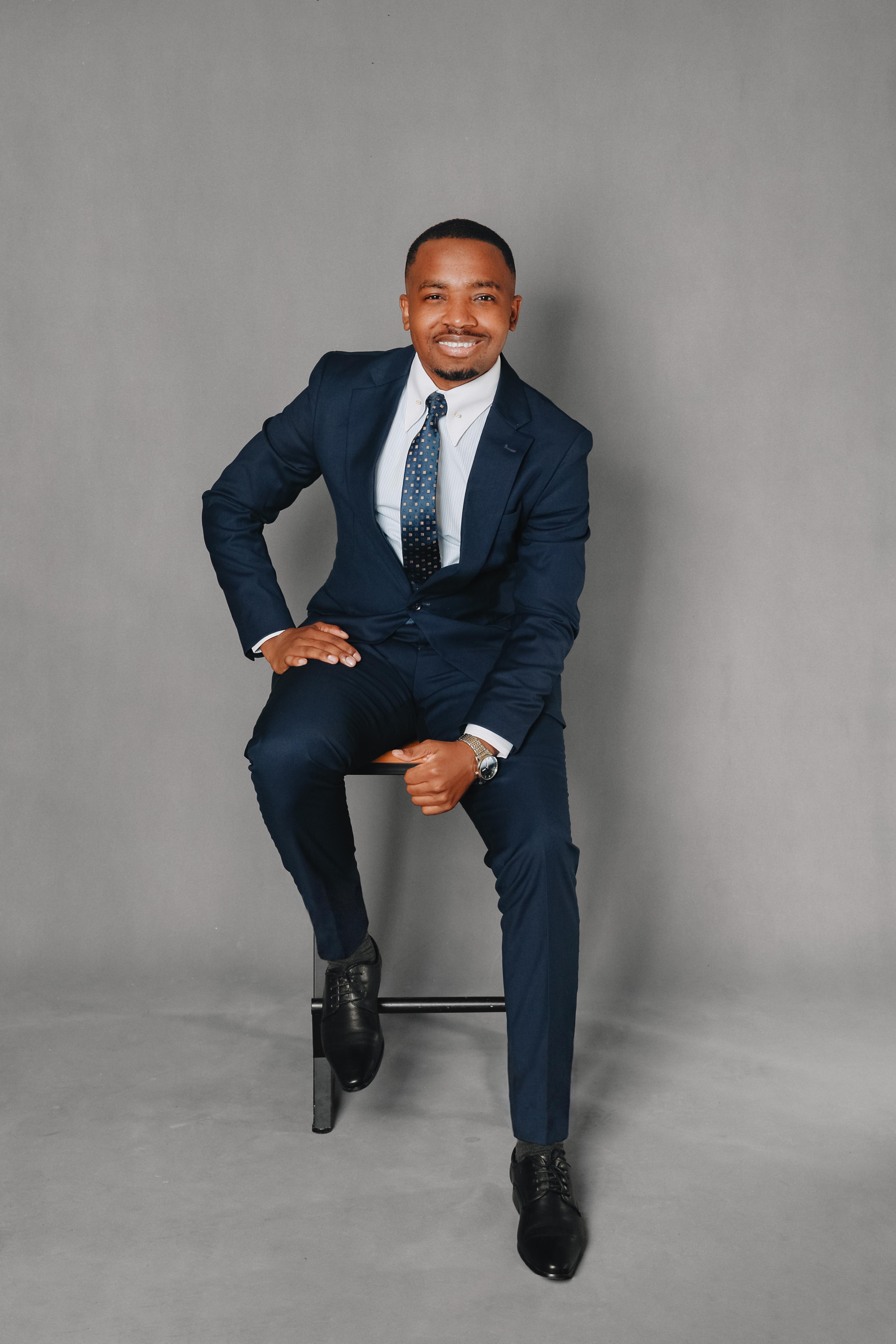 Dr. Pascal Kwangwari in a navy suit